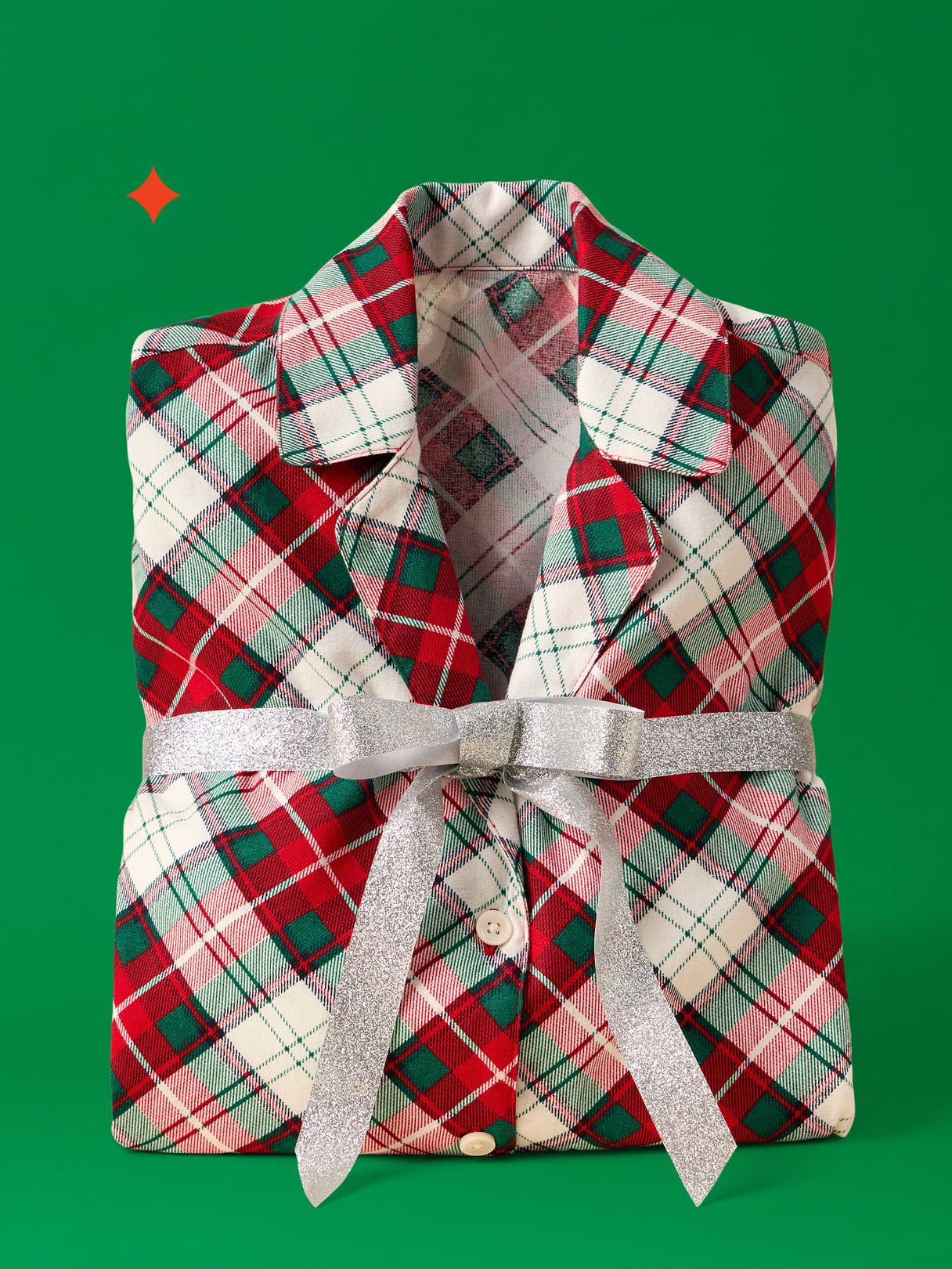 a red and green plaid shirt with a bow on it