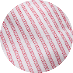 Close-up of white fabric with thin diagonal red stripes.