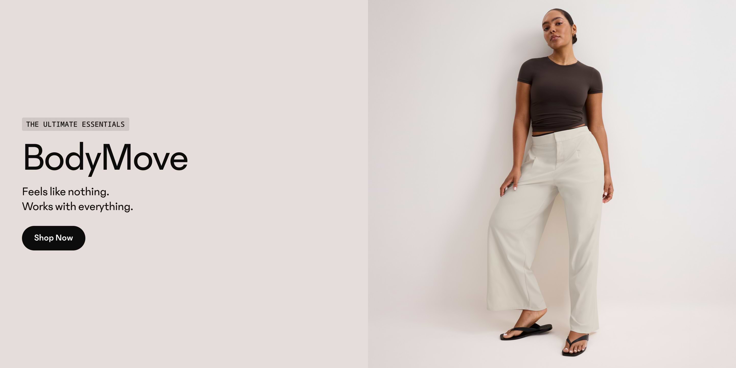 BodyMove apparel ad showing a person in a dark fitted T‑shirt, light wide‑leg pants, and black sandals leaning against a white wall, with “The Ultimate Essentials BodyMove” text and a “Shop Now” button.