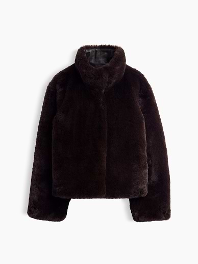 a brown fur jacket that is hanging on a white background