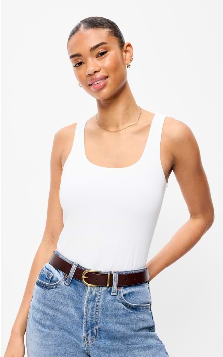 A female model wearing a white bodysuit.