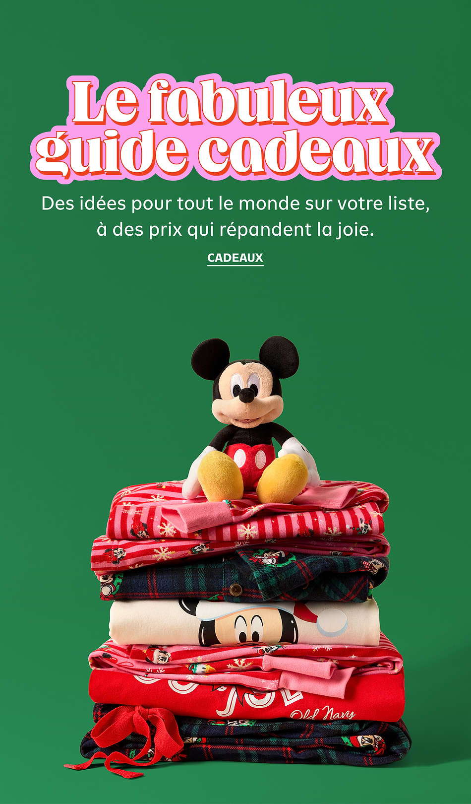 French holiday gift guide ad: headline “Le fabuleux guide cadeaux,” with a plush Mickey Mouse sitting on a stack of folded red and pink festive pajamas against a green background.