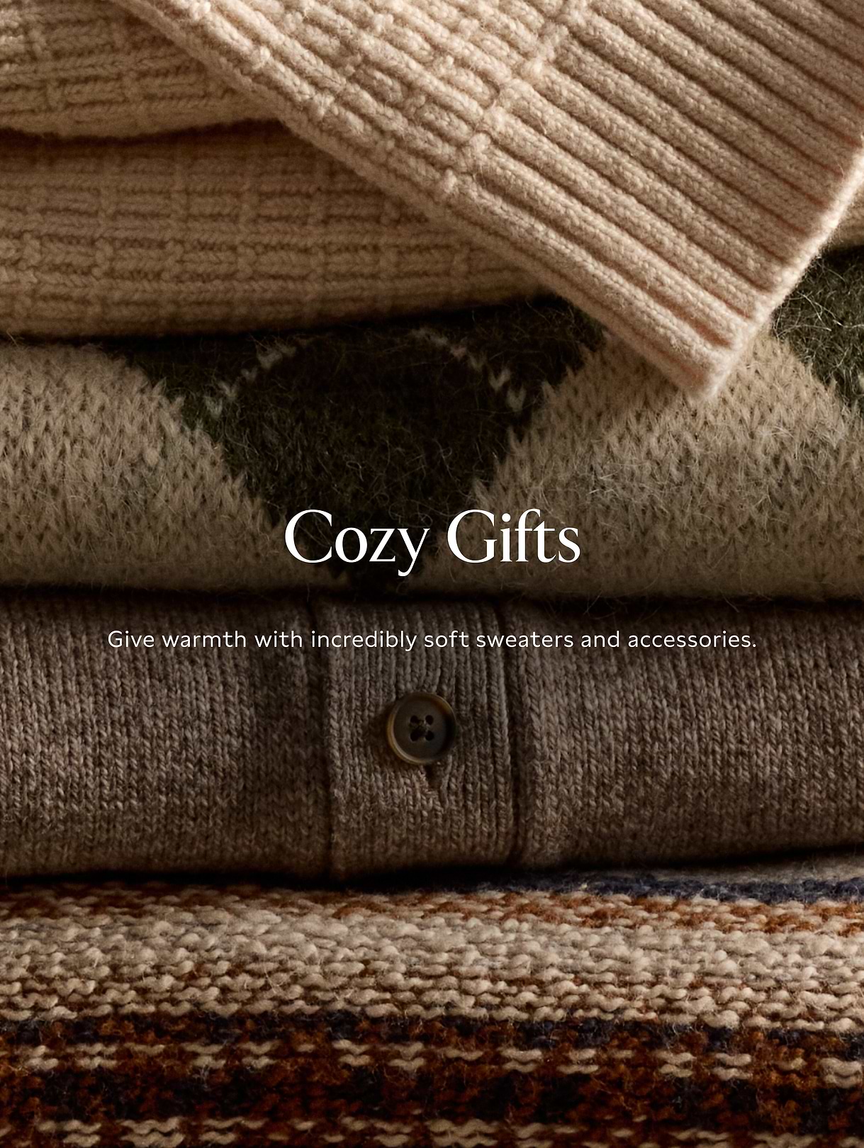 Promotional banner showing stacked soft knit sweaters in neutral tones with “Cozy Gifts” text.