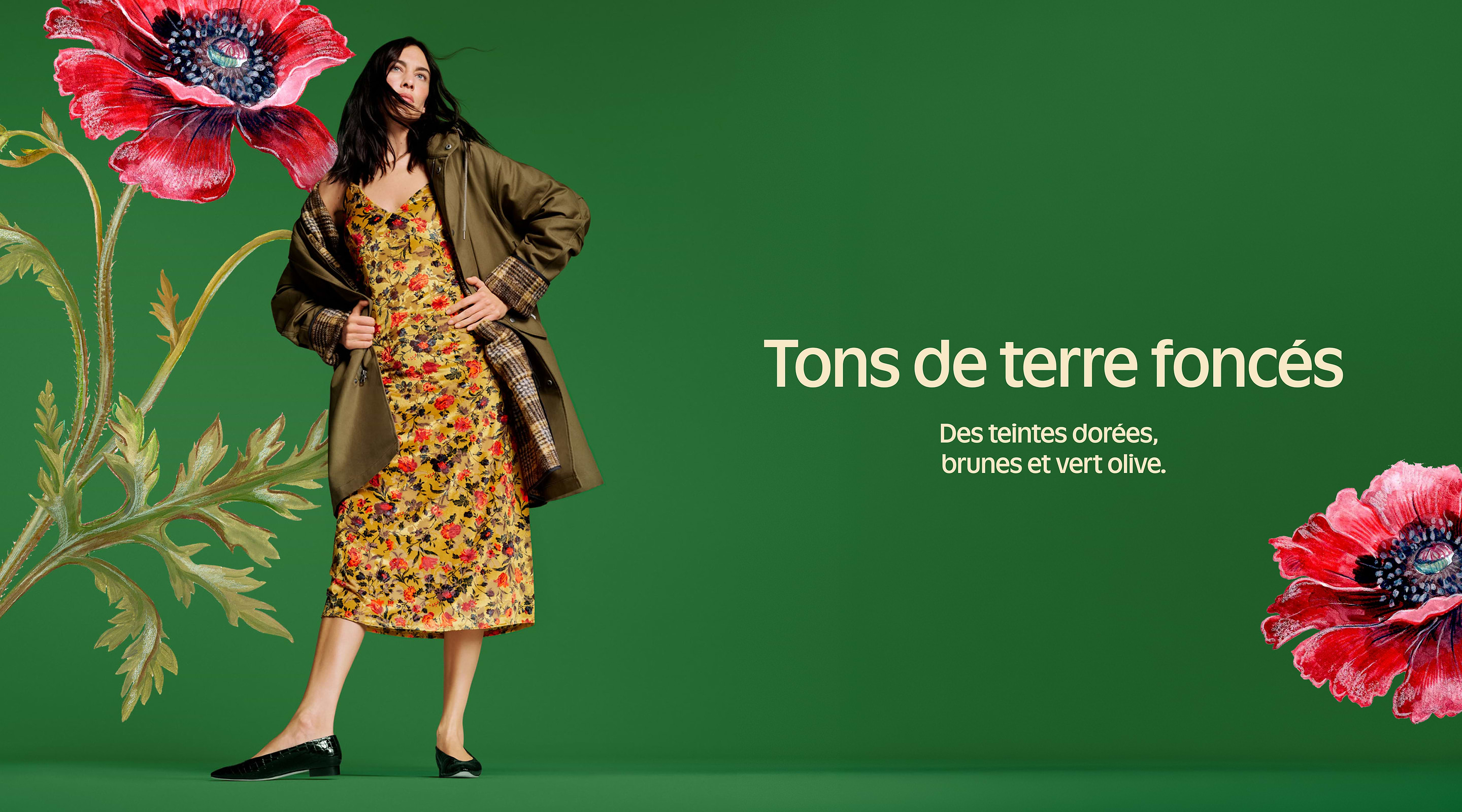 Alt text: Model in a yellow floral dress and olive coat stands on a green background with large red flowers; text reads “Tons de terre foncés — Des teintes dorées, brunes et vert olive.”