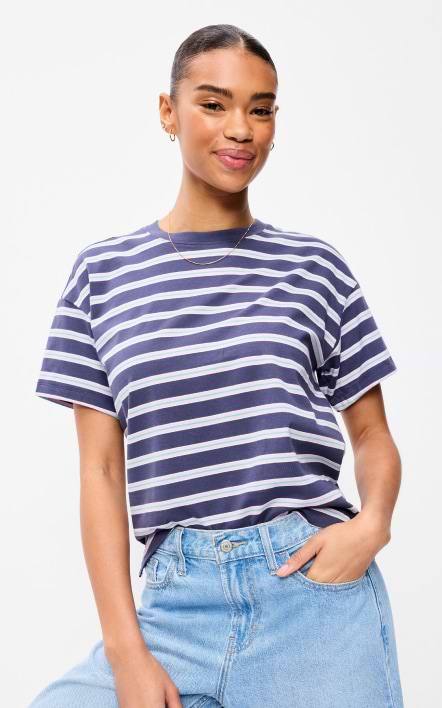 A female model wearing a striped crew-neck T-shirt.