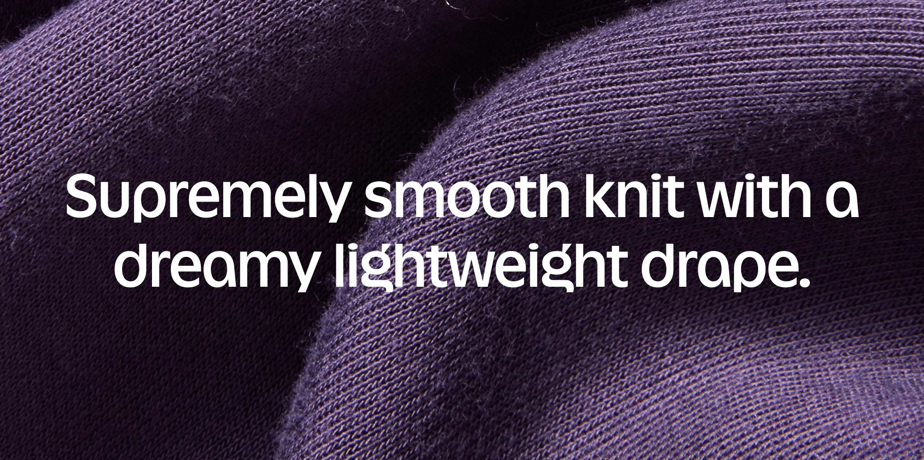 Close-up of folded purple knit fabric with text: “Supremely smooth knit with a dreamy lightweight drape.”