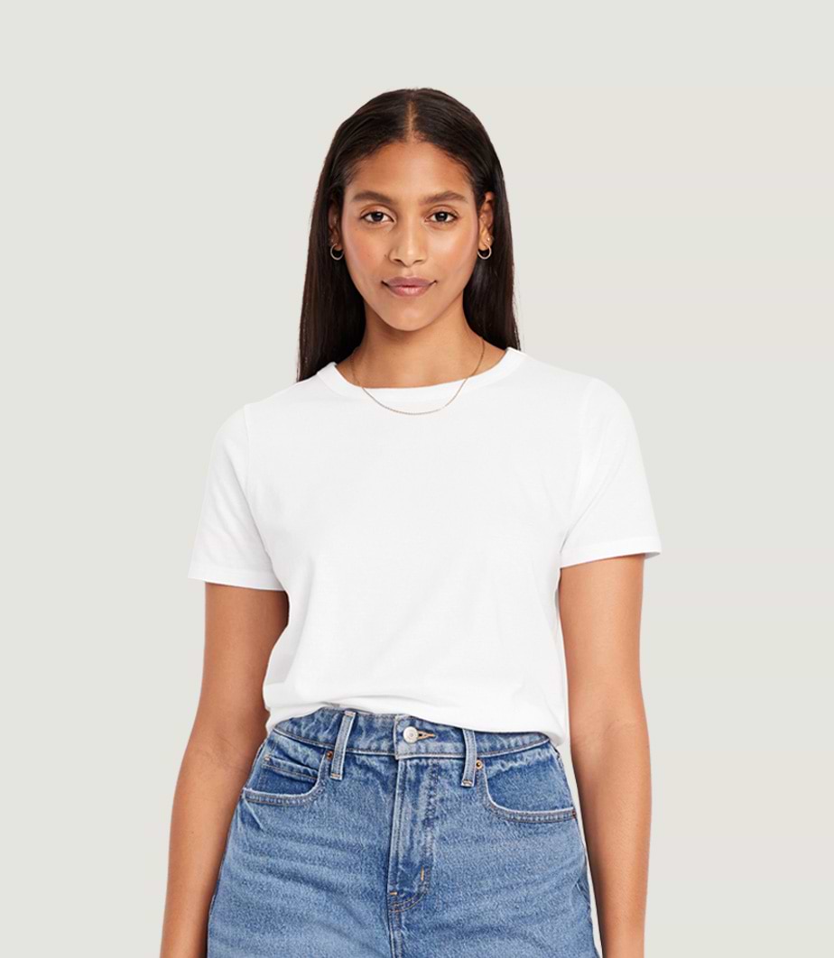 A female model wearing a basic short sleeve t-shirt.