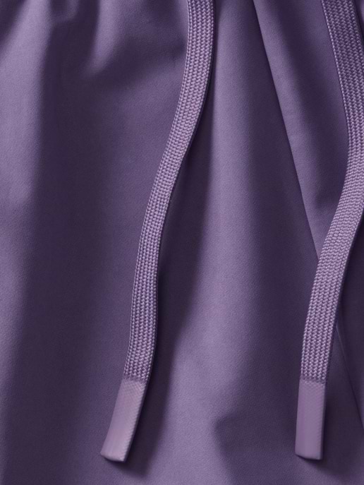 Close-up of purple drawstring cords on matching fabric.