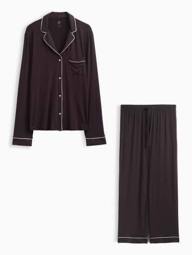 a black pajama set with white pants and a white shirt