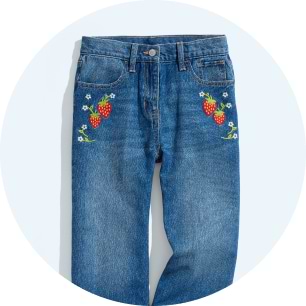 Image of Old Navy blue jeans with colorful floral embroidery on the front.