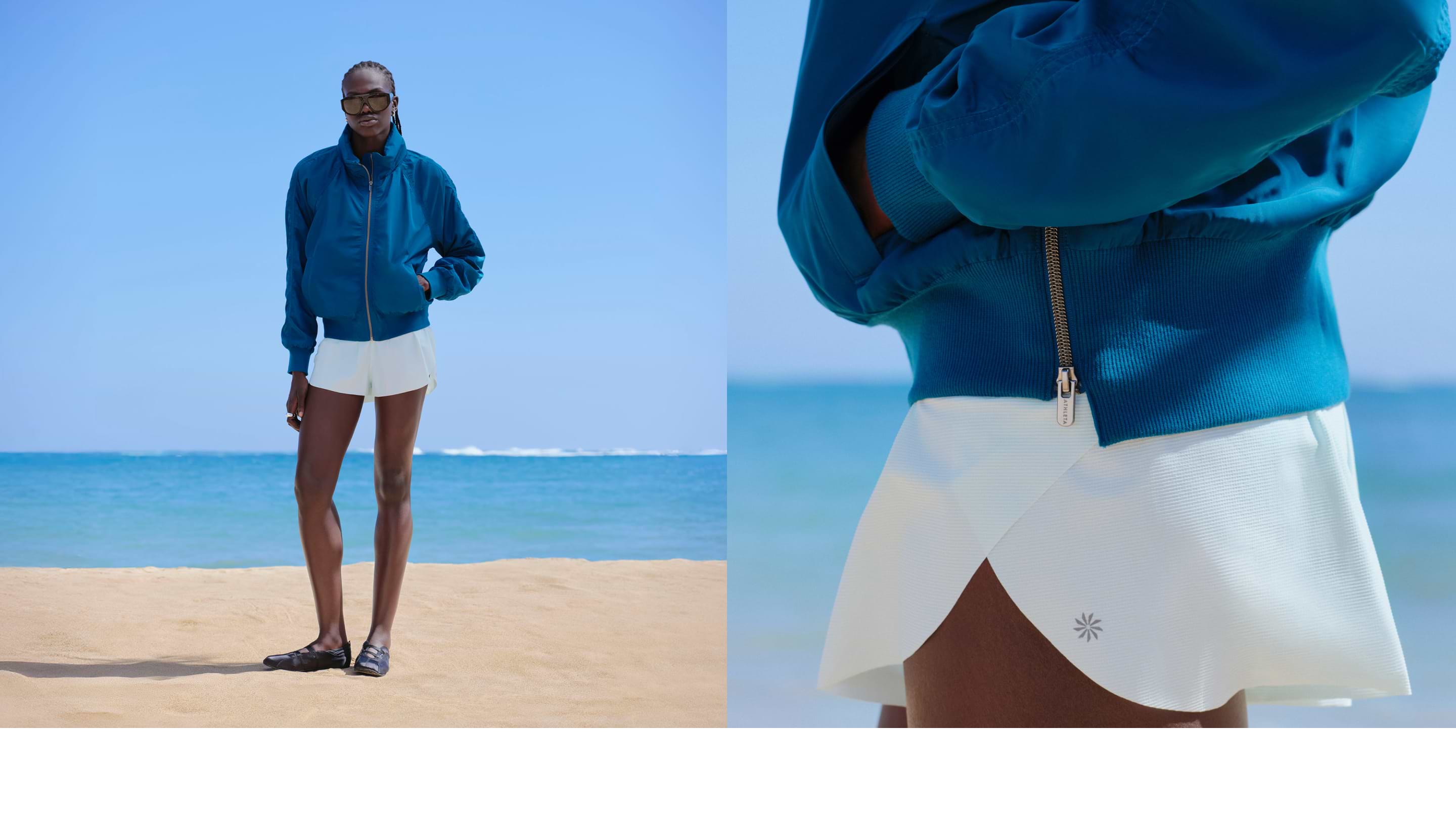 Model on beach in teal bomber jacket and white shorts