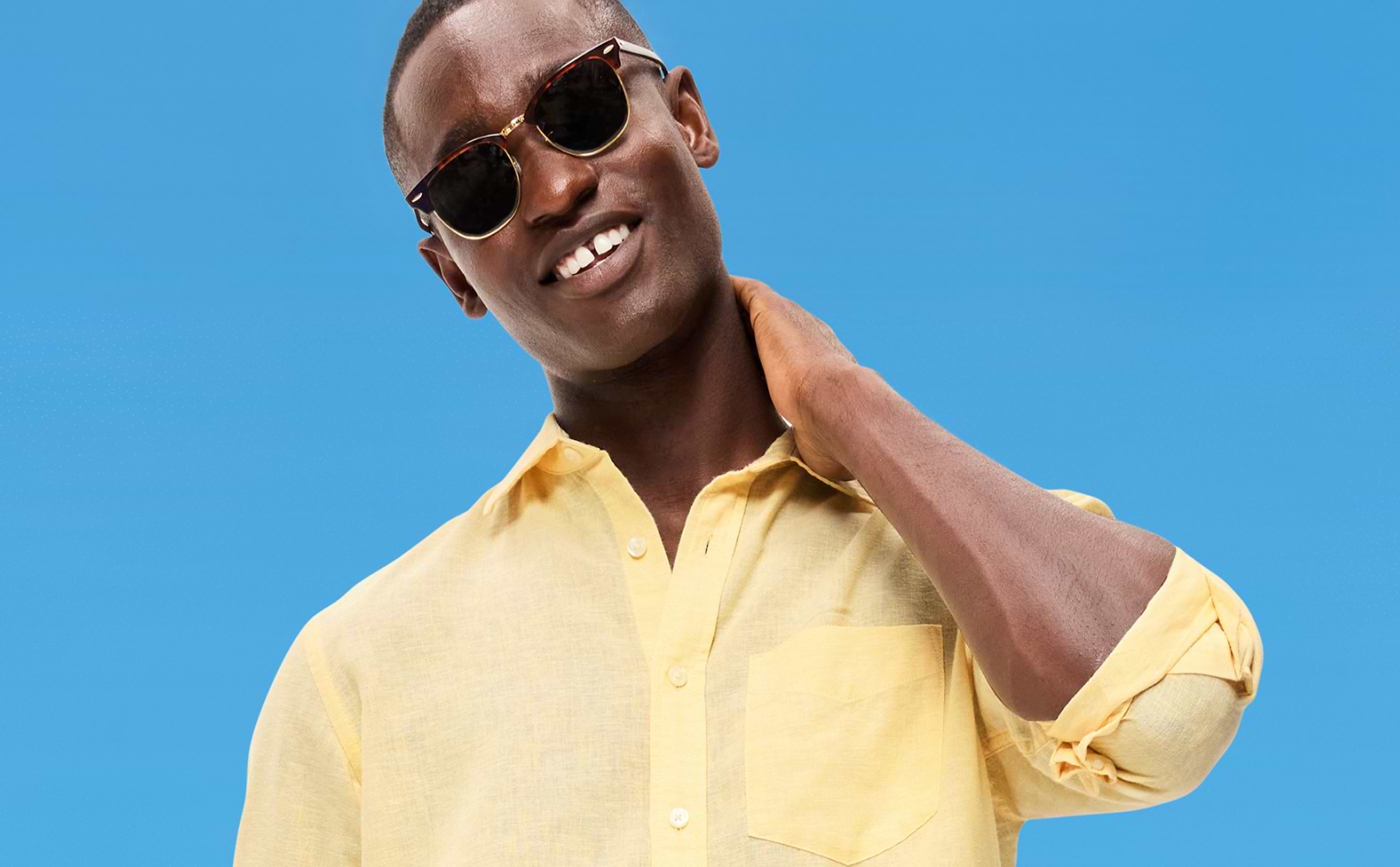Image of a male model wearing an Old Navy yellow button down shirt.