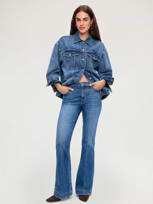 A medium wash flare jean paired with a denim jacket.