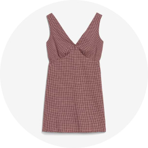 Mauve sleeveless mini dress with a deep V-neck and textured knit pattern.