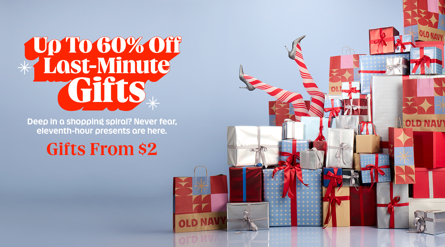 Snowy holiday scene with “Welcome to Presentville” text: winter apparel and gifts arranged on mini mountains—fur jacket, green handbag, “Merry” sweater, reindeer slippers, pom‑pom hat, boots, and reindeer knit—surrounded by tiny skiers, a gondola lift, and a red helicopter.