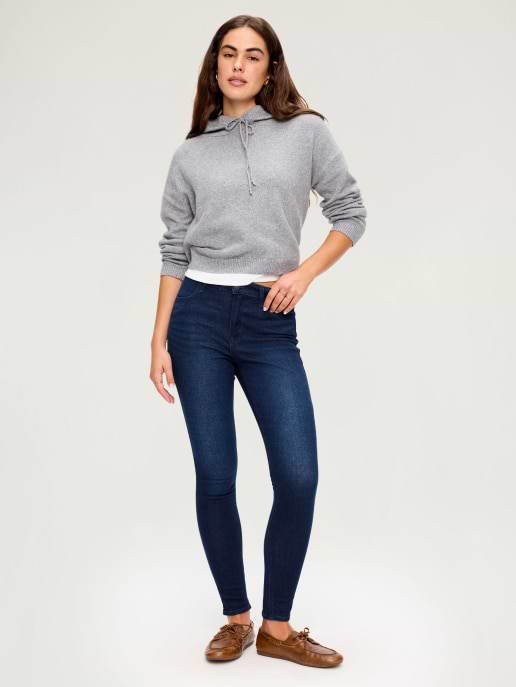 A dark wash ankle length skinny jean.
