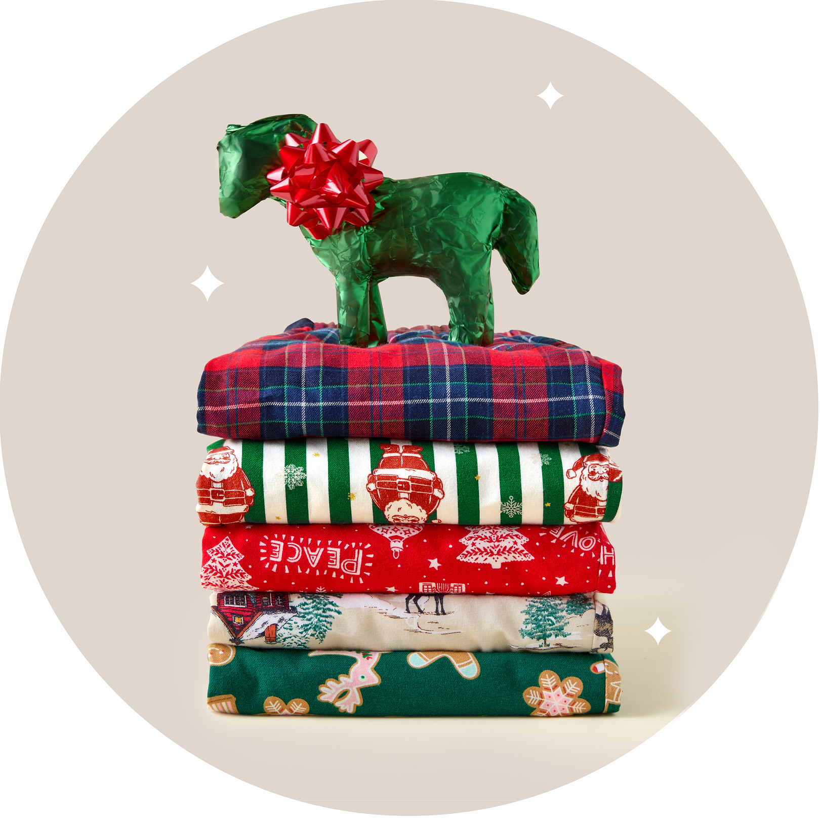 a stack of folded blankets with a horse on top of them