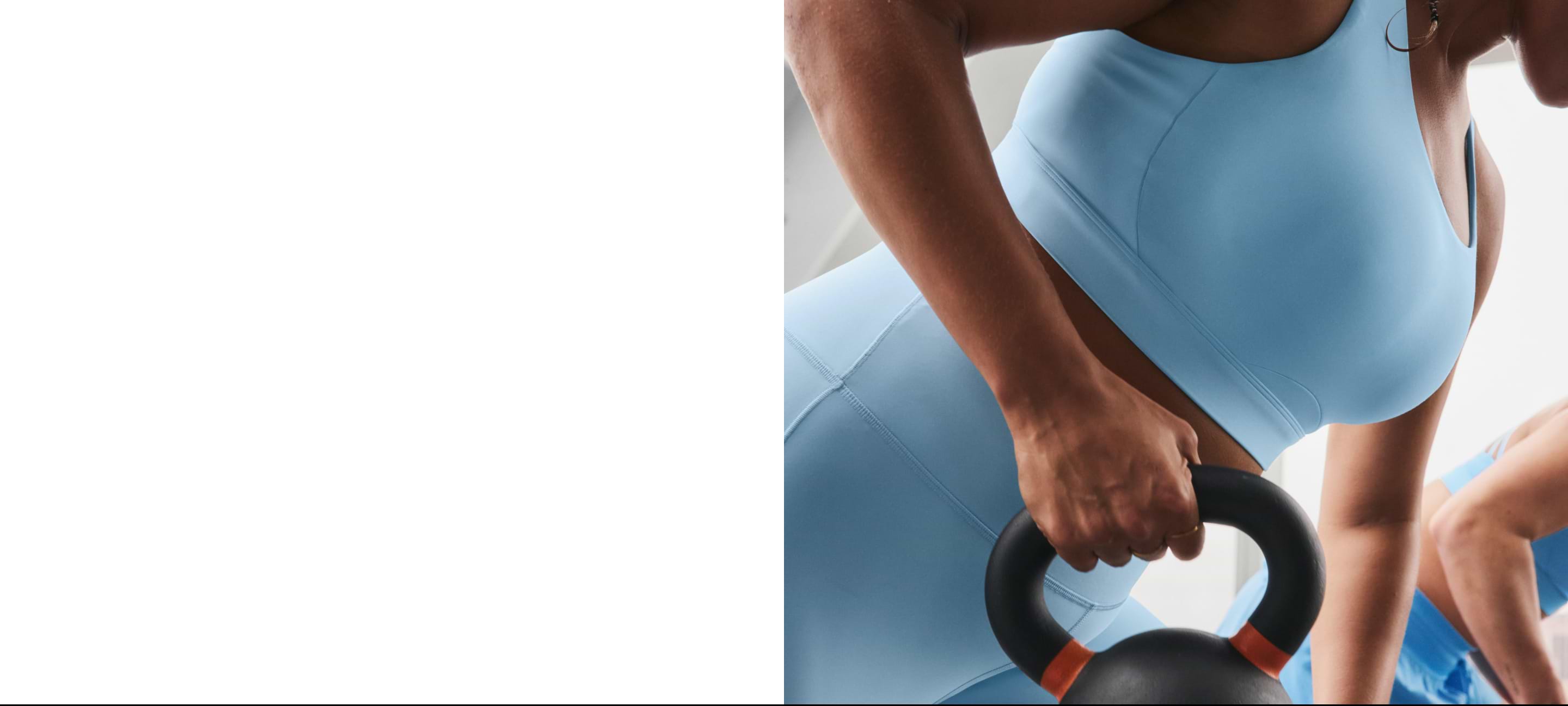 Woman wearing the Interval Sports Bra holding a kettle bell.