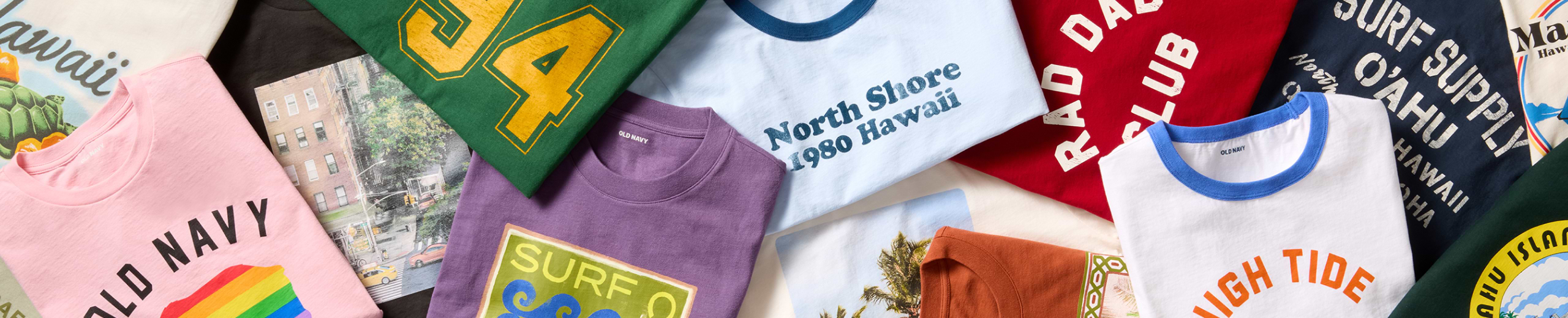 Image of a variety of colorful graphic tee shirts.