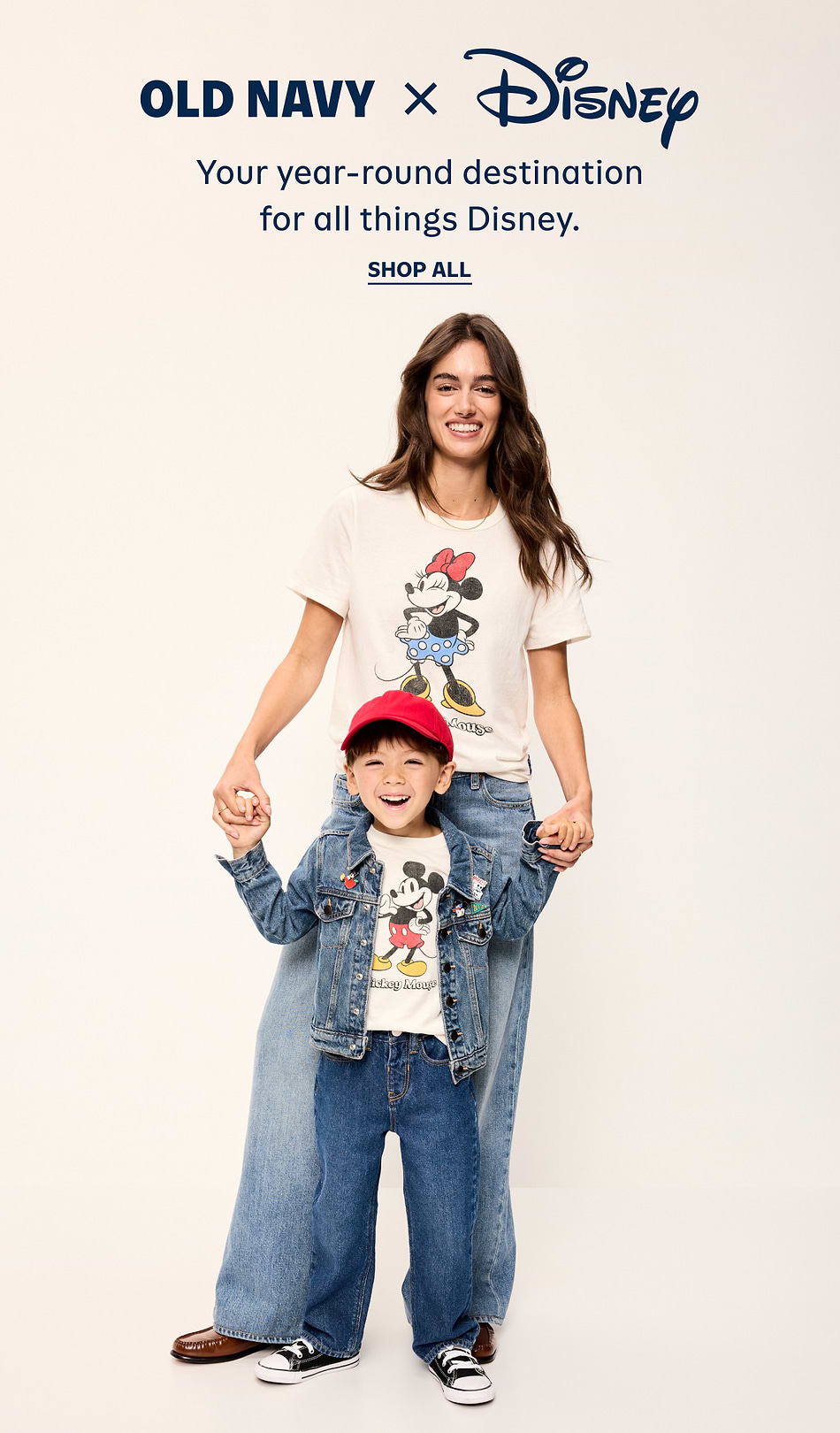 Old Navy x Disney ad: an adult and child hold hands, wearing denim and Mickey/Minnie graphic tees; text reads “Your year-round destination for all things Disney. Shop All.”