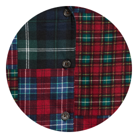 Close-up of a patchwork plaid shirt with red, green, and blue checks and buttons.