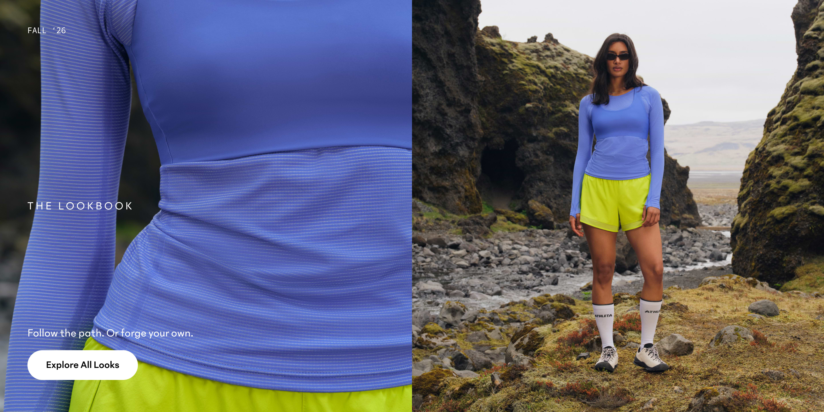 Person in a long-sleeve blue athletic top and neon yellow shorts standing on rocky, mossy terrain between cliffs.