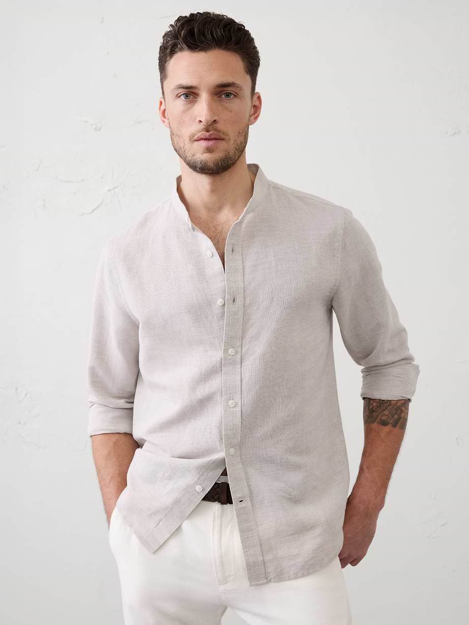 Man in tan shirt and white jeans. 