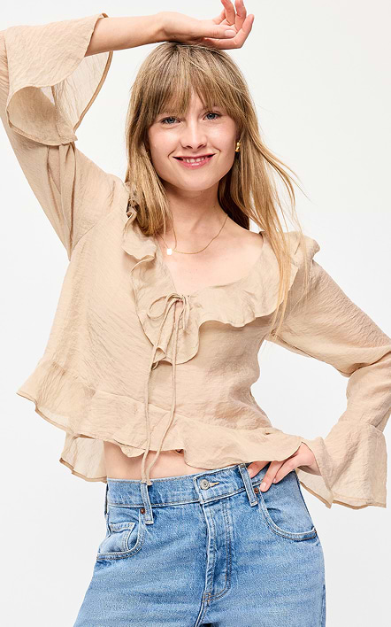 A female model wearing long-sleeve blouse.