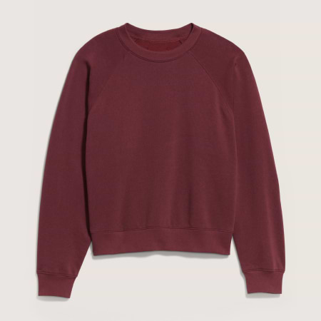 Burgundy crewneck sweatshirt with long raglan sleeves and ribbed cuffs.
