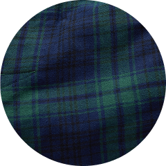 Close-up of dark blue and green tartan plaid fabric.