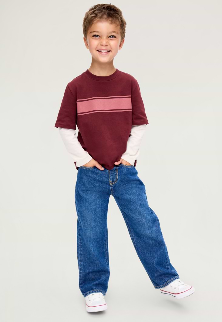 Image of a toddler boy model wearing Old Navy relaxed fit jeans.
