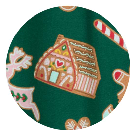 Green fabric with gingerbread house, candy cane, and reindeer cookie pattern.