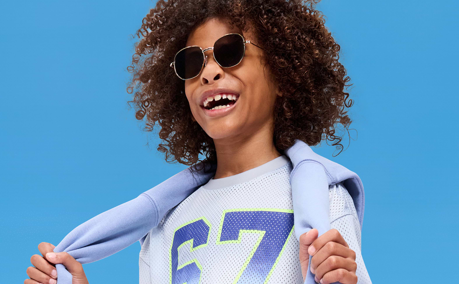 Image of a young boy model wearing an Old Navy graphic t-shirt.