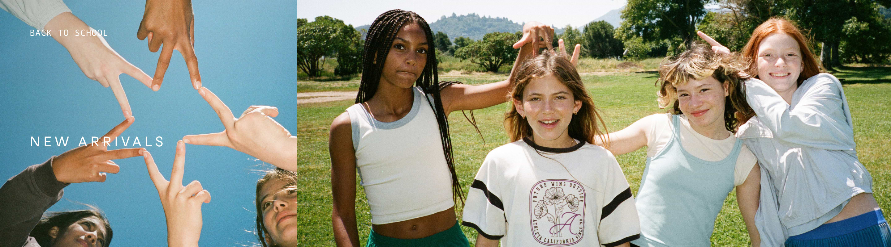 Smiling girls in a sunny park make peace signs; nearby hands form a star against a blue sky. Text reads “Back to School – New Arrivals.”