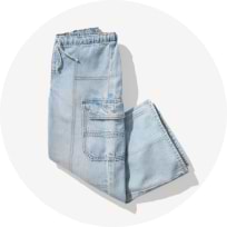 Girls light wash denim skort with front wrap design.