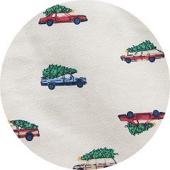 Repeating pattern of cartoon cars carrying Christmas trees on white fabric.