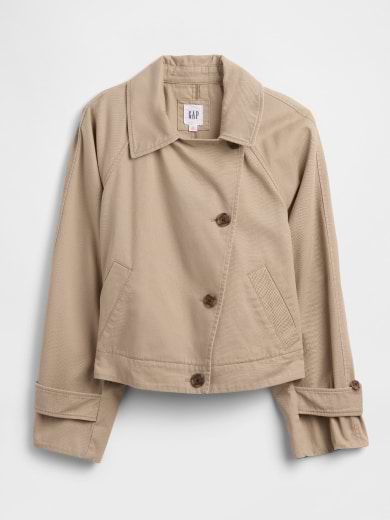 Beige cropped jacket with wide collar, diagonal button closure, slanted pockets, and cuff tabs.