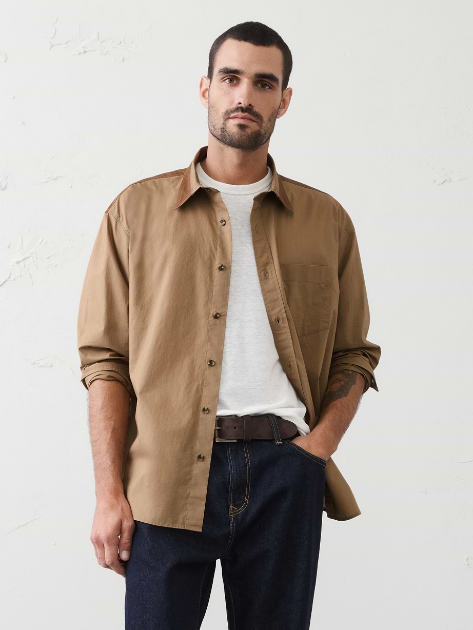 Man in tan button down shirt. 