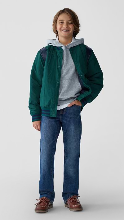 A young model dressed in straight non stretch jeans.