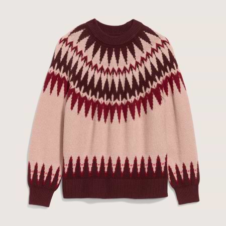 Blush pink crewneck sweater with burgundy and red Fair Isle zigzag pattern; ribbed cuffs and hem.