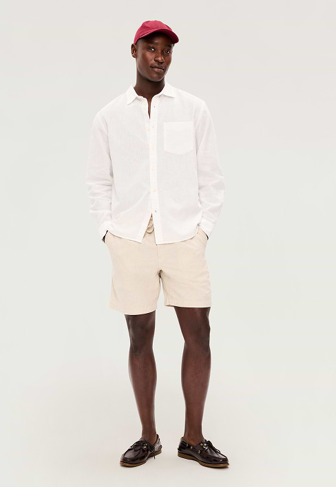 A male model wears a pair of tan Pull-On shorts
