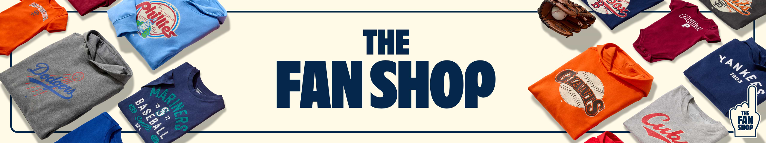 “The Fan Shop” banner surrounded by assorted MLB team shirts and hoodies.