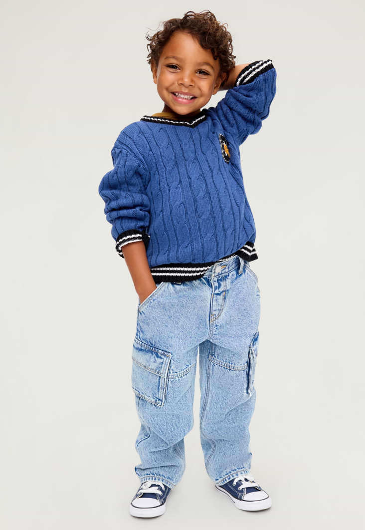 Image of a toddler boy model wearing Old Navy loose fit jeans.