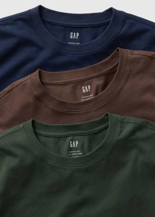 Three GAP long‑sleeve crewneck tees in navy, brown, and dark green, stacked.