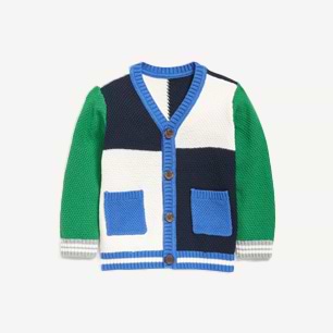 Color-block knit cardigan with green sleeves, navy and white body, blue ribbed trim, wooden buttons, and two blue front pockets.