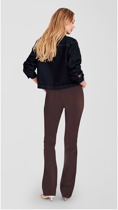 Female model wearing high waisted pixie flare pants.