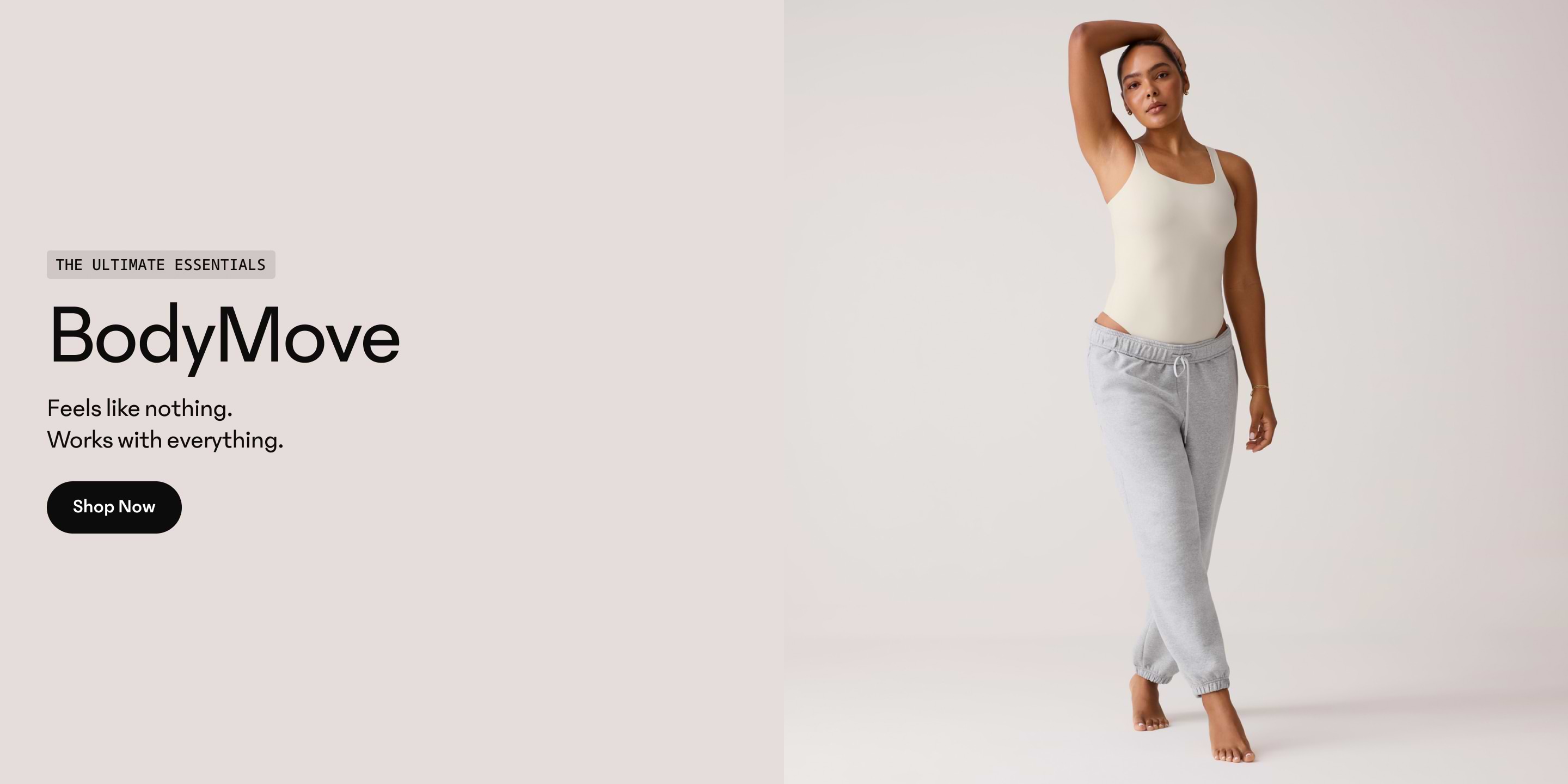 BodyMove essentials ad: model in cream bodysuit and gray joggers posing barefoot on a light background with the text “Feels like nothing. Works with everything.”