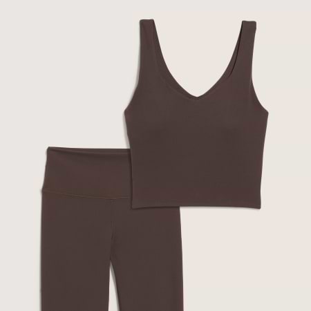 Dark brown V-neck crop tank with matching high-waisted leggings, laid flat.