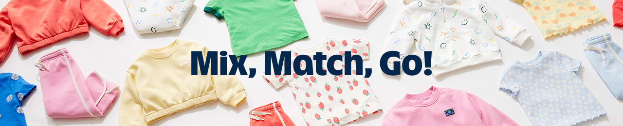 Flat lay of colorful kids’ sweatshirts, tees, and joggers with the text “Mix, Match, Go!”